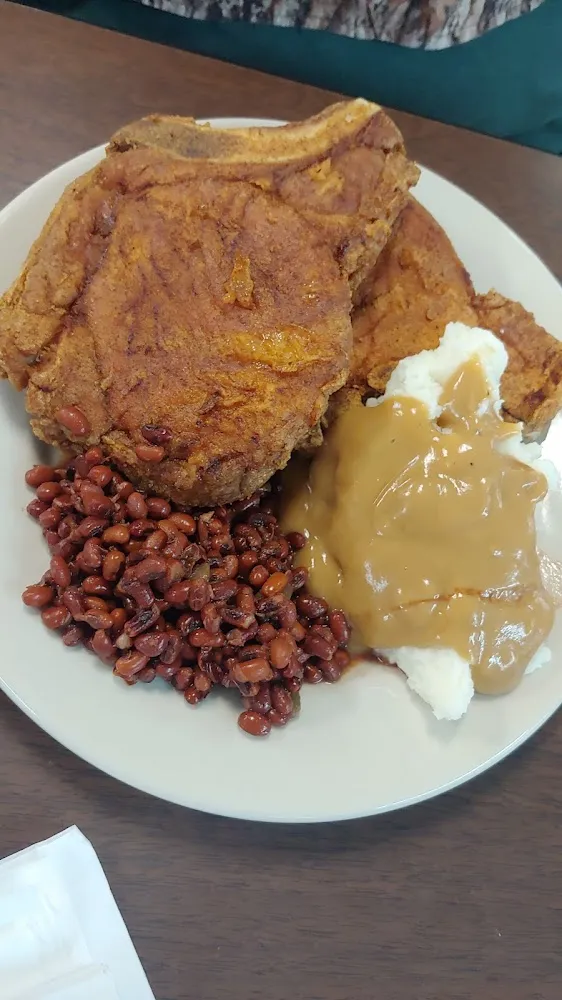 Fried Pork Chops Mash Taters and Gravy and Field Peas